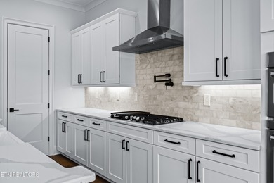 This beautifully appointed 4-bedroom, 3-bath residence offers 3 on Tennessee National Golf Club in Tennessee - for sale on GolfHomes.com, golf home, golf lot