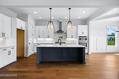 This beautifully appointed 4-bedroom, 3-bath residence offers 3 on Tennessee National Golf Club in Tennessee - for sale on GolfHomes.com, golf home, golf lot