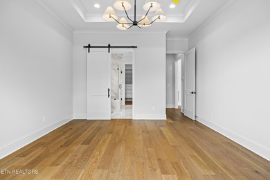 This beautifully appointed 4-bedroom, 3-bath residence offers 3 on Tennessee National Golf Club in Tennessee - for sale on GolfHomes.com, golf home, golf lot