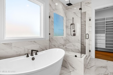 This beautifully appointed 4-bedroom, 3-bath residence offers 3 on Tennessee National Golf Club in Tennessee - for sale on GolfHomes.com, golf home, golf lot