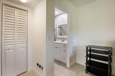 Open the door to this beautifully renovated 1/1.5 bath condo and on Poinciana Golf Club in Florida - for sale on GolfHomes.com, golf home, golf lot