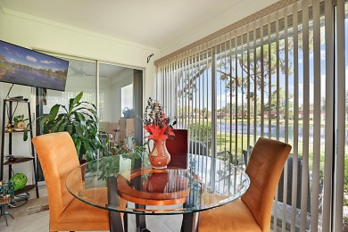 Open the door to this beautifully renovated 1/1.5 bath condo and on Poinciana Golf Club in Florida - for sale on GolfHomes.com, golf home, golf lot