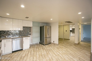 Overlooking a sparkling pool, this stylish open concept, N/S on Scottsdale Shadows in Arizona - for sale on GolfHomes.com, golf home, golf lot