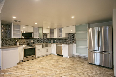 Overlooking a sparkling pool, this stylish open concept, N/S on Scottsdale Shadows in Arizona - for sale on GolfHomes.com, golf home, golf lot