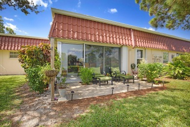 Open the door to this beautifully renovated 1/1.5 bath condo and on Poinciana Golf Club in Florida - for sale on GolfHomes.com, golf home, golf lot