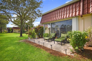 Open the door to this beautifully renovated 1/1.5 bath condo and on Poinciana Golf Club in Florida - for sale on GolfHomes.com, golf home, golf lot