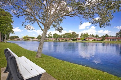Open the door to this beautifully renovated 1/1.5 bath condo and on Poinciana Golf Club in Florida - for sale on GolfHomes.com, golf home, golf lot