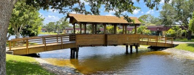 Open the door to this beautifully renovated 1/1.5 bath condo and on Poinciana Golf Club in Florida - for sale on GolfHomes.com, golf home, golf lot