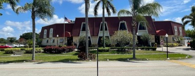 Open the door to this beautifully renovated 1/1.5 bath condo and on Poinciana Golf Club in Florida - for sale on GolfHomes.com, golf home, golf lot