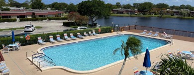 Open the door to this beautifully renovated 1/1.5 bath condo and on Poinciana Golf Club in Florida - for sale on GolfHomes.com, golf home, golf lot