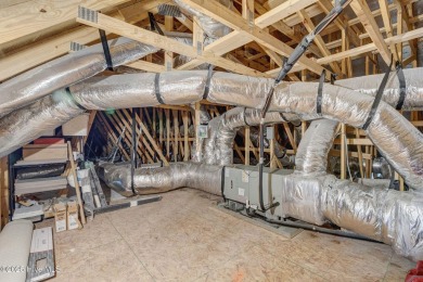 Built in 2022 in the sought-after Cape Fear National section of on Cape Fear National At Brunswick Forest in North Carolina - for sale on GolfHomes.com, golf home, golf lot