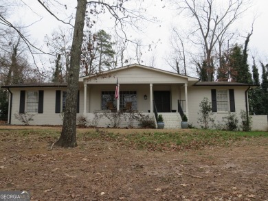 This sprawling brick ranch is in the perfect location! Minutes on Cherokee Golf and Country Club in Georgia - for sale on GolfHomes.com, golf home, golf lot