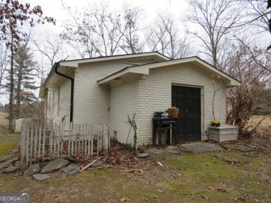 This sprawling brick ranch is in the perfect location! Minutes on Cherokee Golf and Country Club in Georgia - for sale on GolfHomes.com, golf home, golf lot