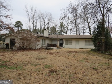 This sprawling brick ranch is in the perfect location! Minutes on Cherokee Golf and Country Club in Georgia - for sale on GolfHomes.com, golf home, golf lot