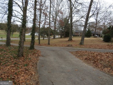 This sprawling brick ranch is in the perfect location! Minutes on Cherokee Golf and Country Club in Georgia - for sale on GolfHomes.com, golf home, golf lot