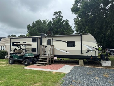 Lot with lots of extras.  Camper included is in great condition on Captains Cove Golf and Yacht Club in Virginia - for sale on GolfHomes.com, golf home, golf lot