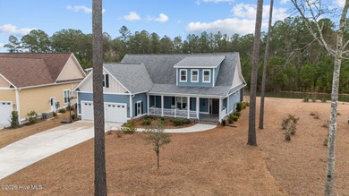 Experience luxury lakeside living in this beautifully appointed on Carolina Colours Golf Club in North Carolina - for sale on GolfHomes.com, golf home, golf lot