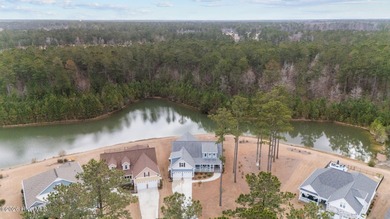 Experience luxury lakeside living in this beautifully appointed on Carolina Colours Golf Club in North Carolina - for sale on GolfHomes.com, golf home, golf lot
