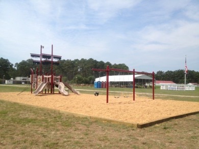 Lot with lots of extras.  Camper included is in great condition on Captains Cove Golf and Yacht Club in Virginia - for sale on GolfHomes.com, golf home, golf lot