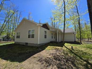Your Forever Home or Perfect Up-North Oasis! Discover comfort on Michaywe Pines Course in Michigan - for sale on GolfHomes.com, golf home, golf lot