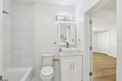 From the welcoming Key West-style front porch, step inside this on Belleair Country Club in Florida - for sale on GolfHomes.com, golf home, golf lot