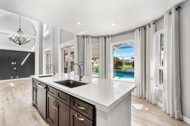 This stunning 4-bedroom home with an office/den overlooking the on Winston Trails Golf Course in Florida - for sale on GolfHomes.com, golf home, golf lot