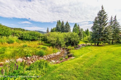 This Country Club Townhome enjoys privacy and a peaceful on The Snowmass Club in Colorado - for sale on GolfHomes.com, golf home, golf lot