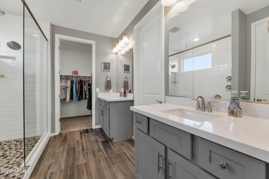 Enjoy panoramic mountain views and Phoenix skyline sunrises from on Verrado Golf Club  in Arizona - for sale on GolfHomes.com, golf home, golf lot