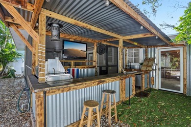From the welcoming Key West-style front porch, step inside this on Belleair Country Club in Florida - for sale on GolfHomes.com, golf home, golf lot