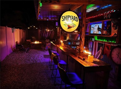 From the welcoming Key West-style front porch, step inside this on Belleair Country Club in Florida - for sale on GolfHomes.com, golf home, golf lot