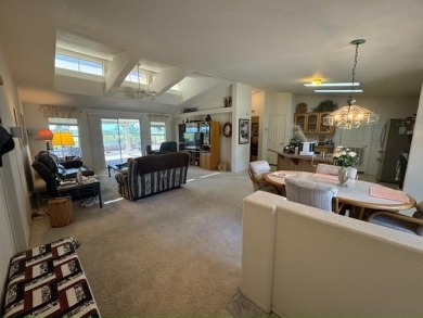 This home is in a beautiful 55+ age qualified resort community on Voyager RV Resort and Golf Course in Arizona - for sale on GolfHomes.com, golf home, golf lot