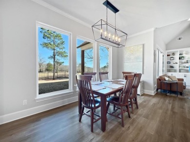 This exquisite custom home sits on the waterfront of hole #8 at on Eagles Bluff Golf Course in Texas - for sale on GolfHomes.com, golf home, golf lot