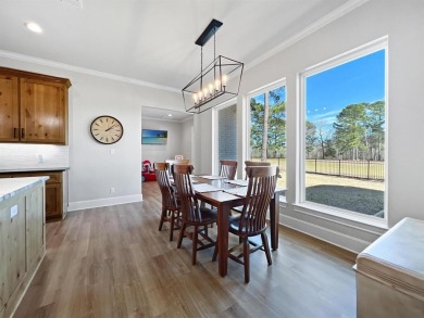 This exquisite custom home sits on the waterfront of hole #8 at on Eagles Bluff Golf Course in Texas - for sale on GolfHomes.com, golf home, golf lot