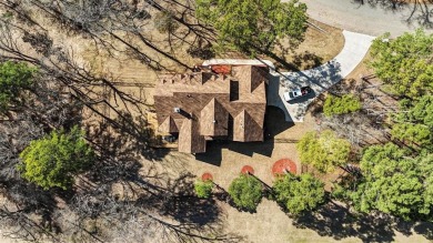 This exquisite custom home sits on the waterfront of hole #8 at on Eagles Bluff Golf Course in Texas - for sale on GolfHomes.com, golf home, golf lot