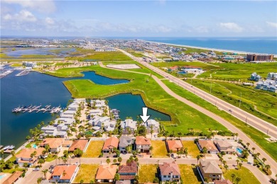 This stunning three-story waterfront residence offers 4 spacious on Palmilla Beach Golf Club in Texas - for sale on GolfHomes.com, golf home, golf lot