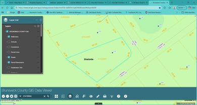 Corner lot partially cleared and ready for your vision, backing on Rivers Edge Golf Club in North Carolina - for sale on GolfHomes.com, golf home, golf lot