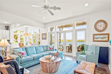 This stunning three-story waterfront residence offers 4 spacious on Palmilla Beach Golf Club in Texas - for sale on GolfHomes.com, golf home, golf lot
