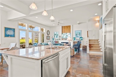 This stunning three-story waterfront residence offers 4 spacious on Palmilla Beach Golf Club in Texas - for sale on GolfHomes.com, golf home, golf lot