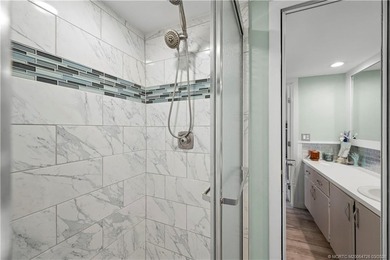 This beautifully updated coastal townhouse blends everyday on Miles Grant Country Club in Florida - for sale on GolfHomes.com, golf home, golf lot