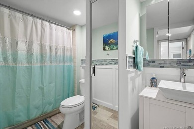 This beautifully updated coastal townhouse blends everyday on Miles Grant Country Club in Florida - for sale on GolfHomes.com, golf home, golf lot