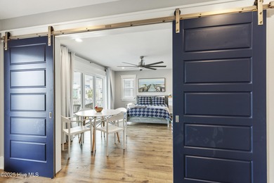 Luxurious Island Living in Sunset Beach: A Stunning 6-Bedroom, 6 on Oyster Bay Golf Links in North Carolina - for sale on GolfHomes.com, golf home, golf lot