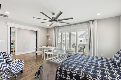 Luxurious Island Living in Sunset Beach: A Stunning 6-Bedroom, 6 on Oyster Bay Golf Links in North Carolina - for sale on GolfHomes.com, golf home, golf lot