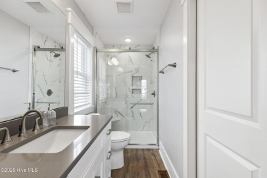 Luxurious Island Living in Sunset Beach: A Stunning 6-Bedroom, 6 on Oyster Bay Golf Links in North Carolina - for sale on GolfHomes.com, golf home, golf lot