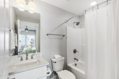 Luxurious Island Living in Sunset Beach: A Stunning 6-Bedroom, 6 on Oyster Bay Golf Links in North Carolina - for sale on GolfHomes.com, golf home, golf lot