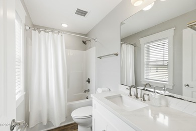 Luxurious Island Living in Sunset Beach: A Stunning 6-Bedroom, 6 on Oyster Bay Golf Links in North Carolina - for sale on GolfHomes.com, golf home, golf lot