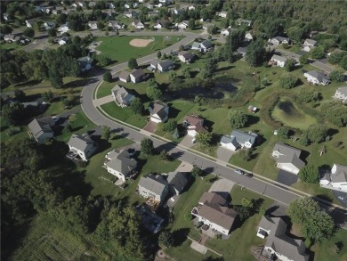 Nestled in a serene neighborhood, this meticulously maintained on Chisago Lakes Golf Course in Minnesota - for sale on GolfHomes.com, golf home, golf lot