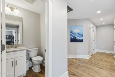 Luxurious Island Living in Sunset Beach: A Stunning 6-Bedroom, 6 on Oyster Bay Golf Links in North Carolina - for sale on GolfHomes.com, golf home, golf lot