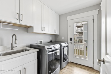 Luxurious Island Living in Sunset Beach: A Stunning 6-Bedroom, 6 on Oyster Bay Golf Links in North Carolina - for sale on GolfHomes.com, golf home, golf lot