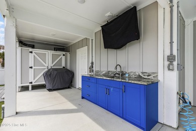 Luxurious Island Living in Sunset Beach: A Stunning 6-Bedroom, 6 on Oyster Bay Golf Links in North Carolina - for sale on GolfHomes.com, golf home, golf lot