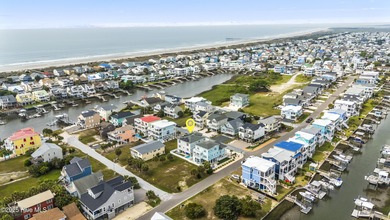 Luxurious Island Living in Sunset Beach: A Stunning 6-Bedroom, 6 on Oyster Bay Golf Links in North Carolina - for sale on GolfHomes.com, golf home, golf lot